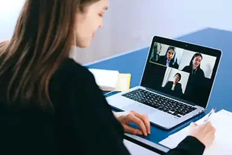 Office worker engaging in a video call on their laptop 
