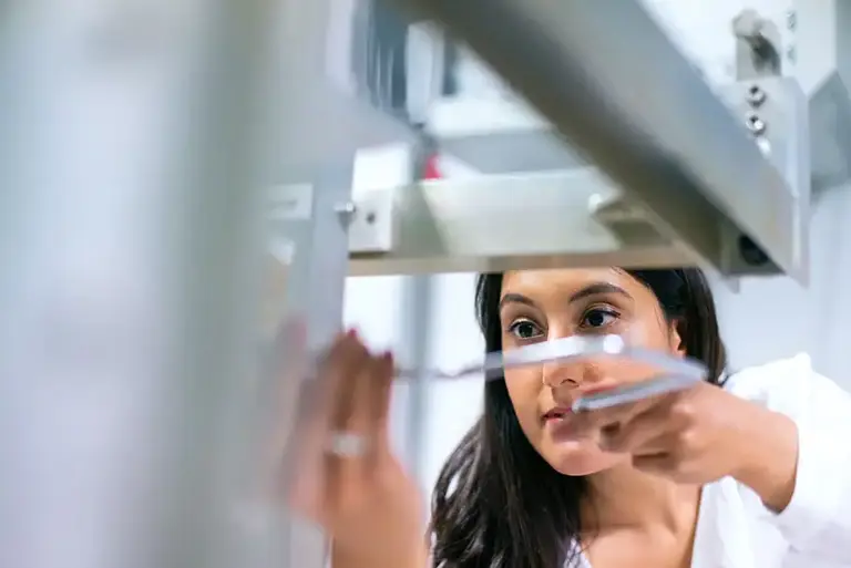 Scientist physically working on an engineering project